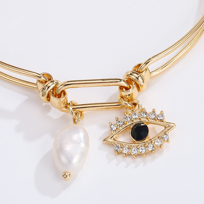 Devil's Eye design with pearls and diamonds