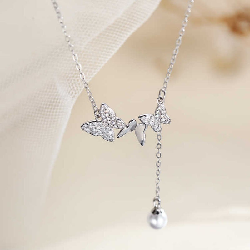 Diamond-set butterfly crystal pearl necklace